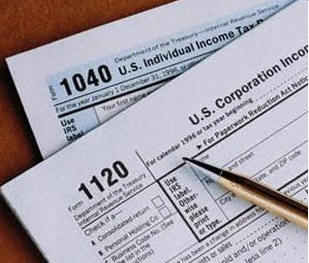 image of form 1040 and form 1120 with golden pencil on them.