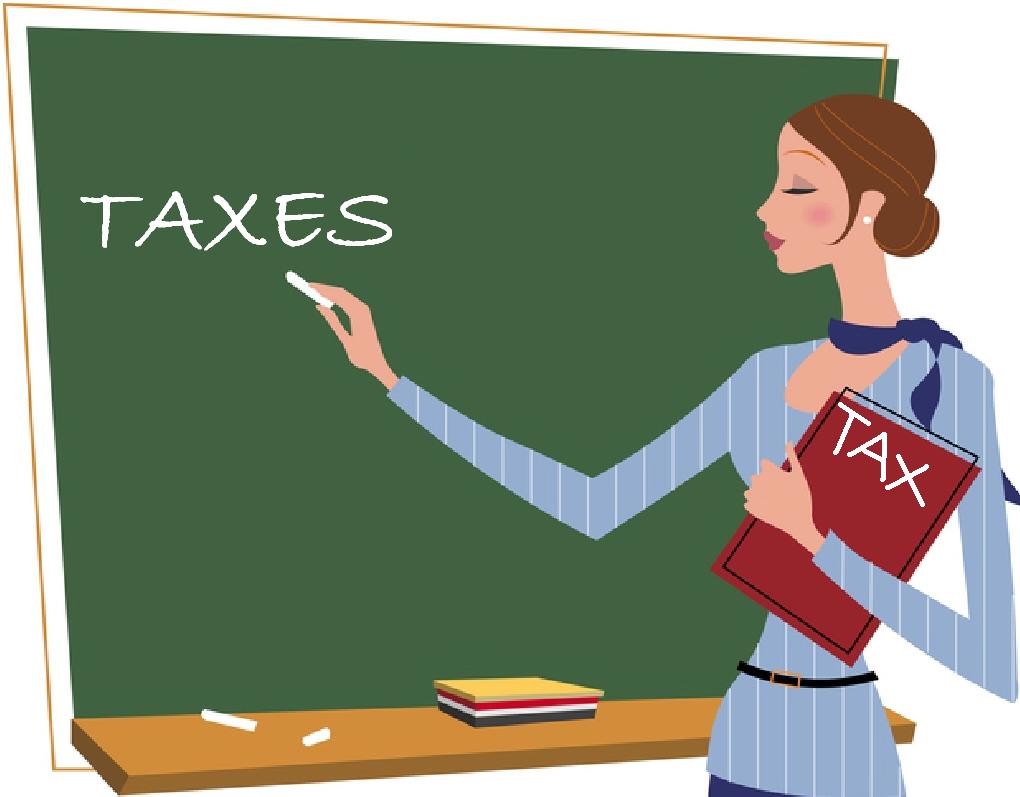 female teacher holding a red that reads TAX and writting the word taxes on a green board.